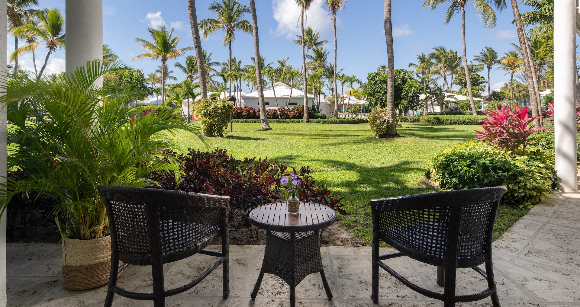 View of the balcony looking into the gardens from inside the Caribbean Premium Walkout Room