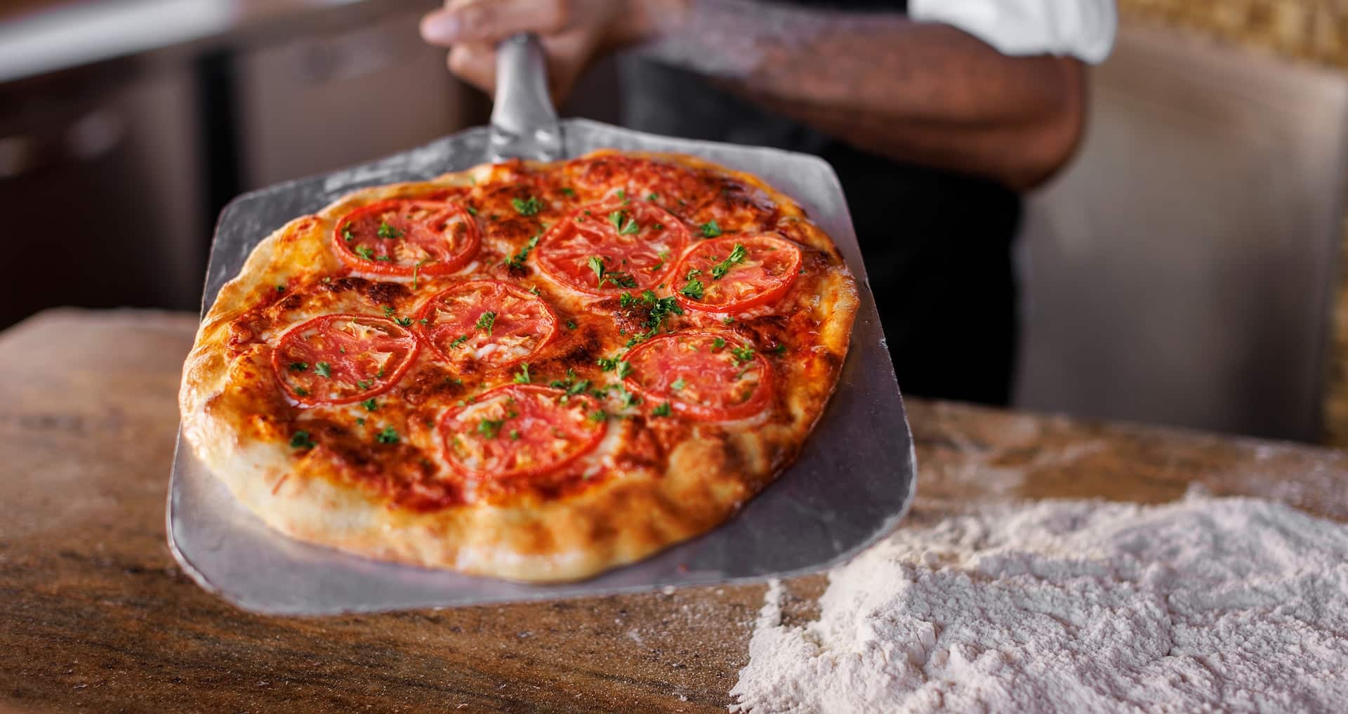 a pizza from Dinos at the Italian Village