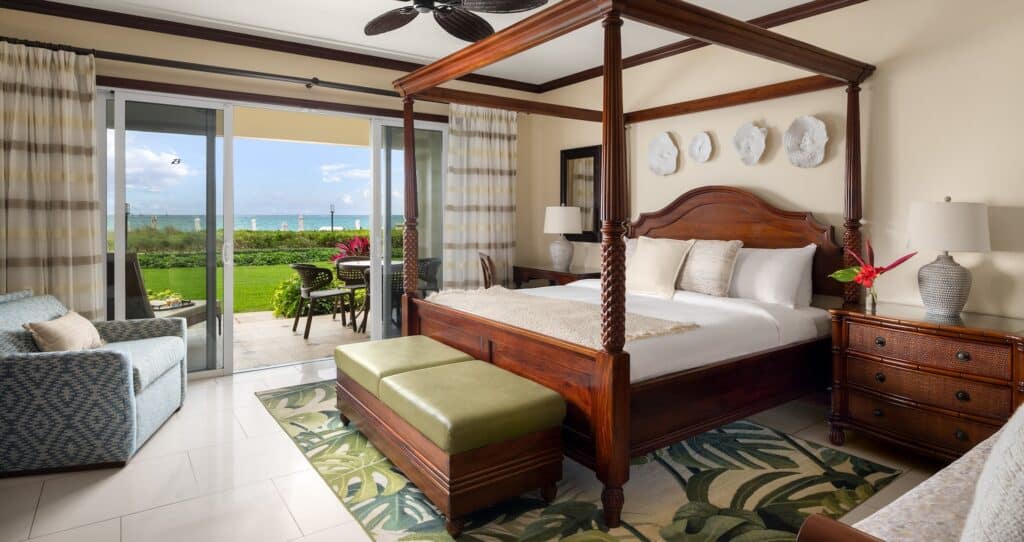 view from inside the Italian Beachfront Two Bedroom Walkout Butler Family Suite looking out onto the balcony