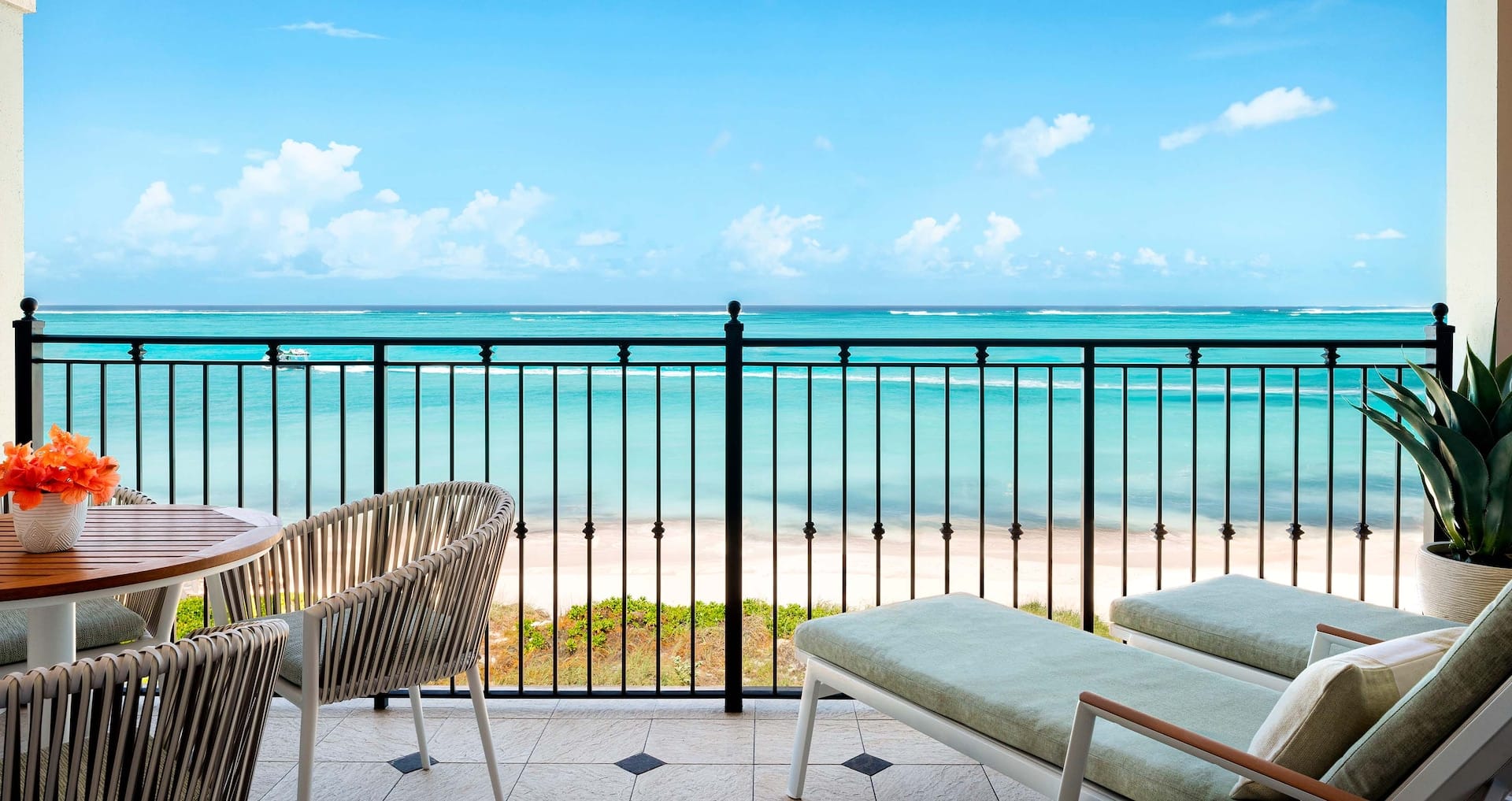 private balcony view of Grace Bay from inside the Italian Oceanfront Concierge Family Suite with Kids Room