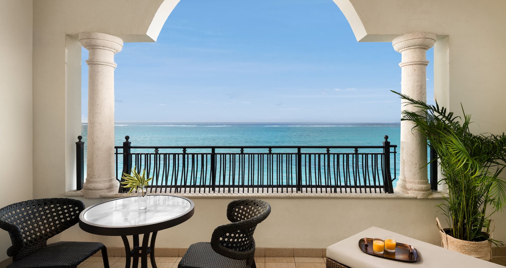 private balcony view of Grace Bay from inside the Italian Oceanfront Concierge Family Suite with Kids Room