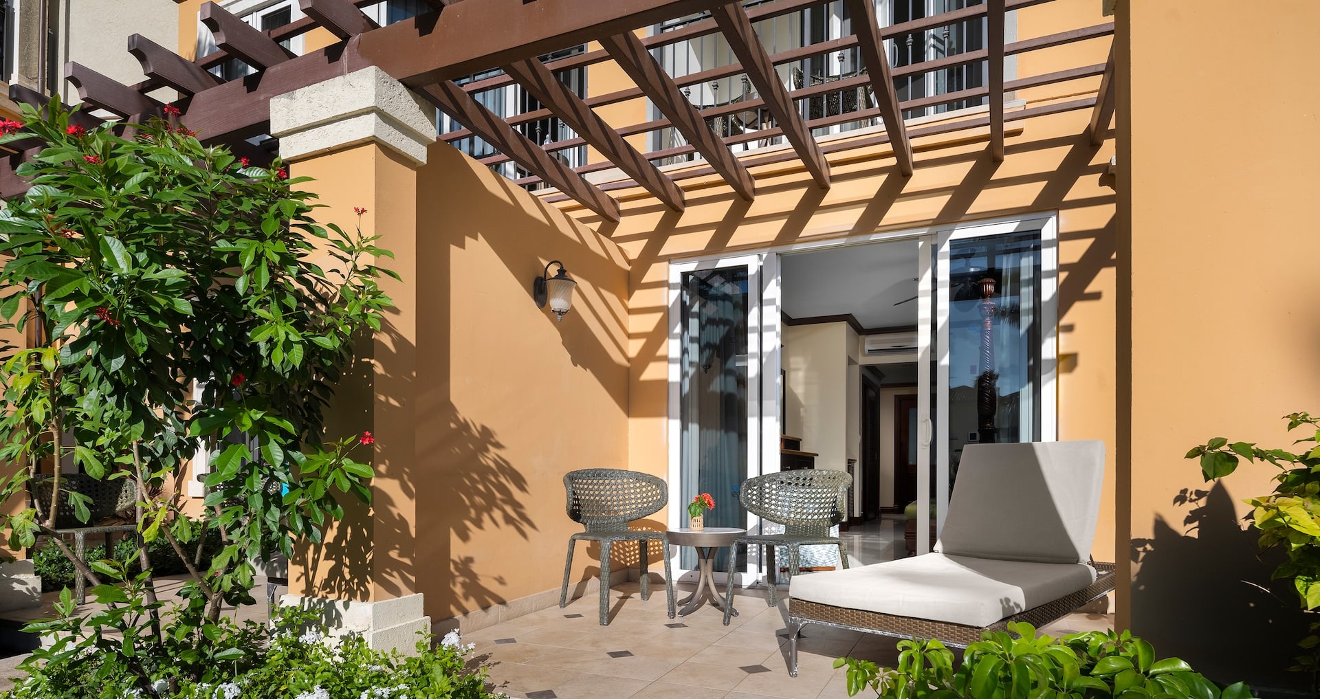 outdoor patio view looking into the Italian Poolside Walkout Concierge Family Suite with Kids Room