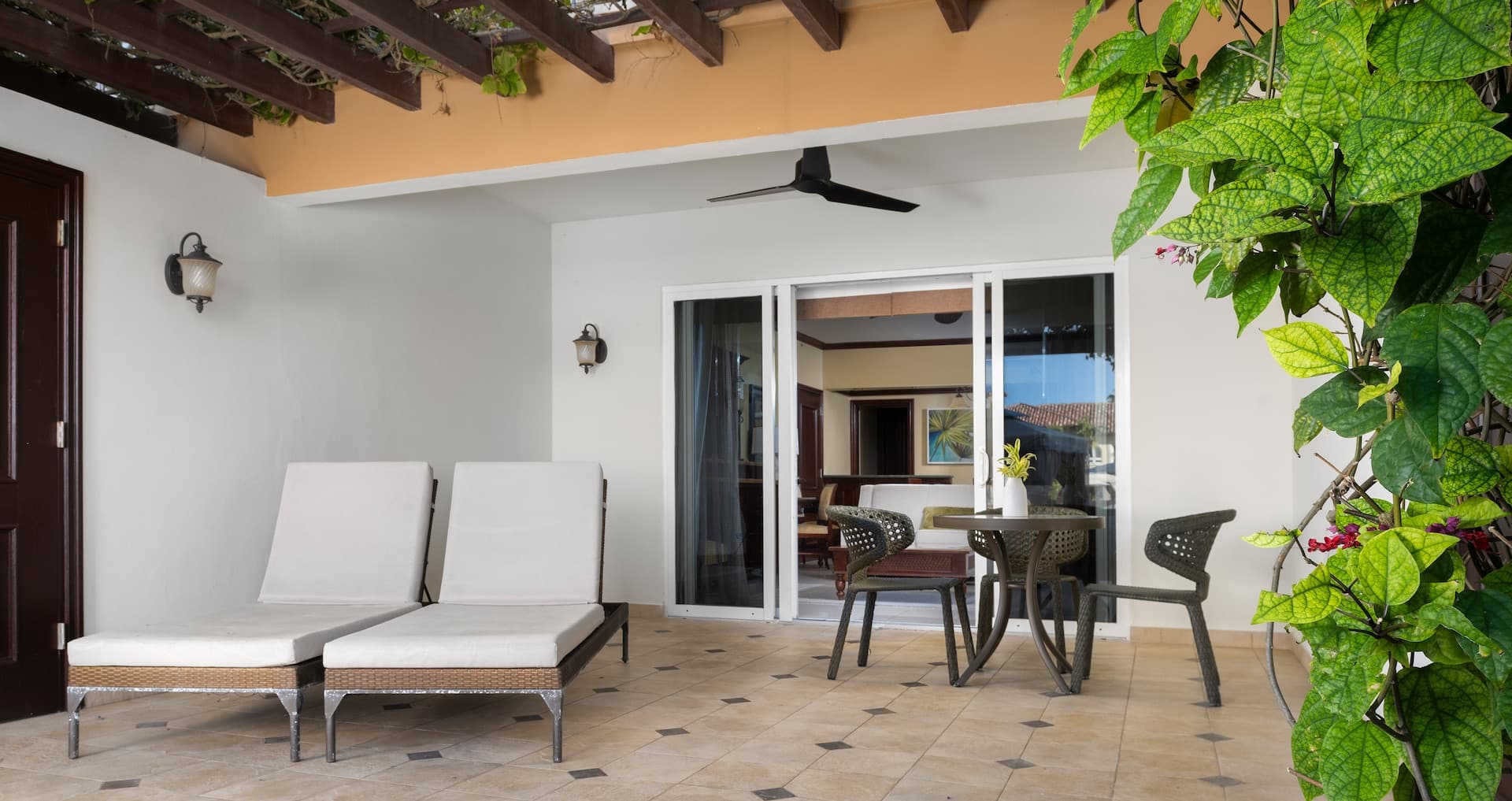 view of the patio from outside the Italian Two Bedroom Poolside Walkout Butler Family Suite