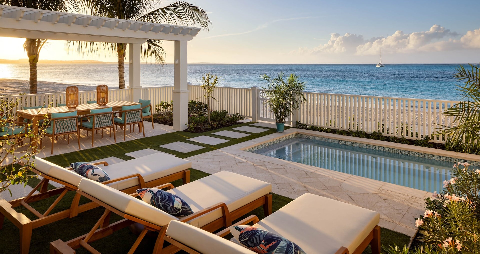 view of the outdoor living area and pool from inside the Treasure Beach CrystalSky 4-Bedroom Reserve Villa