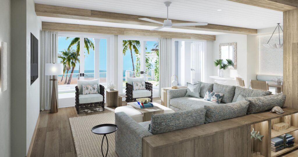 view of the living room looking out onto the beach from inside the Treasure Beach CrystalSky 4-Bedroom Reserve Villa