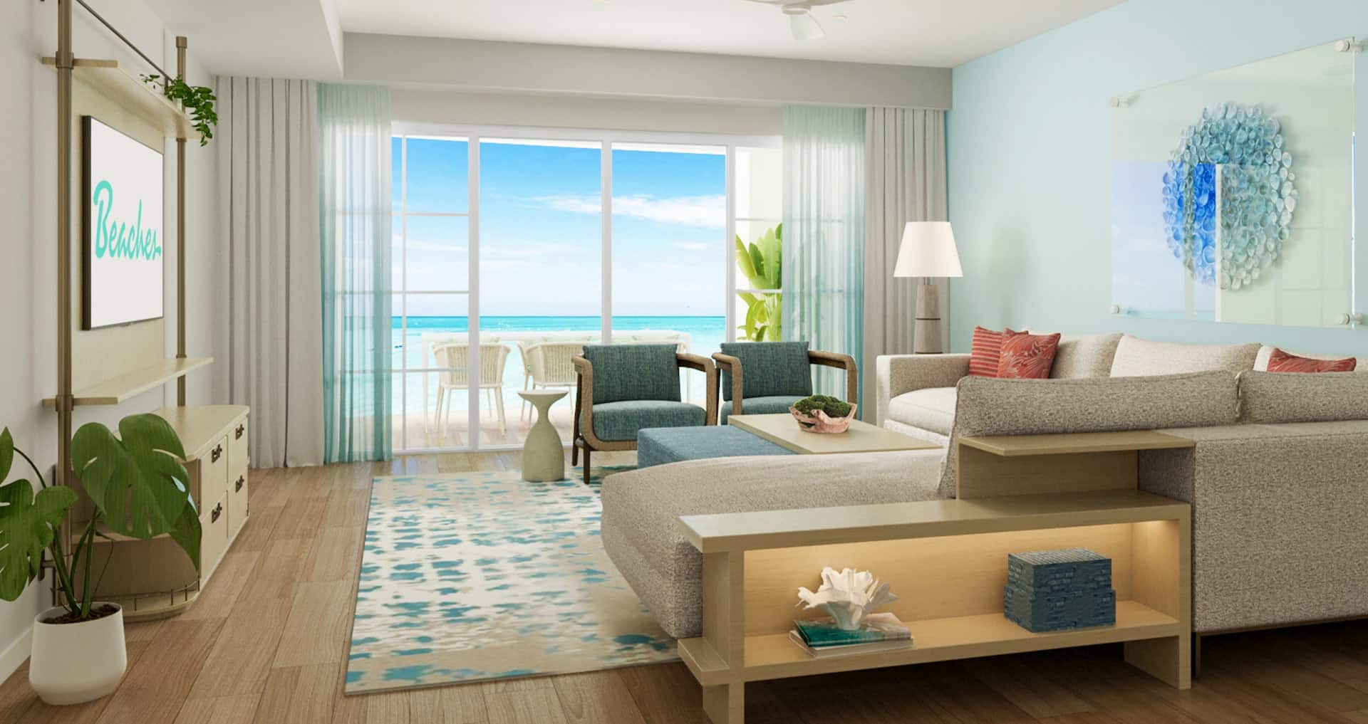 view of the living room overlooking Grace Bay from inside the Treasure Beach Oceanview 2-Bedroom Family Butler Suite